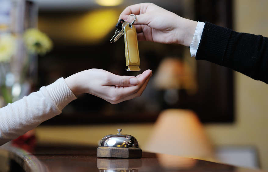 business woman  at the reception of a hotel checking in